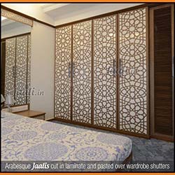 Arabesque Jaalis cut in laminate and pasted over wardrobe shutters